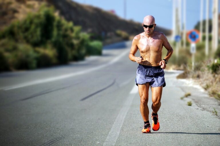 shirtless-guy-running-on-road