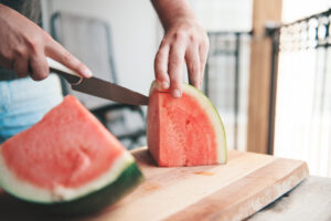 guy-cutting-up-watermelon